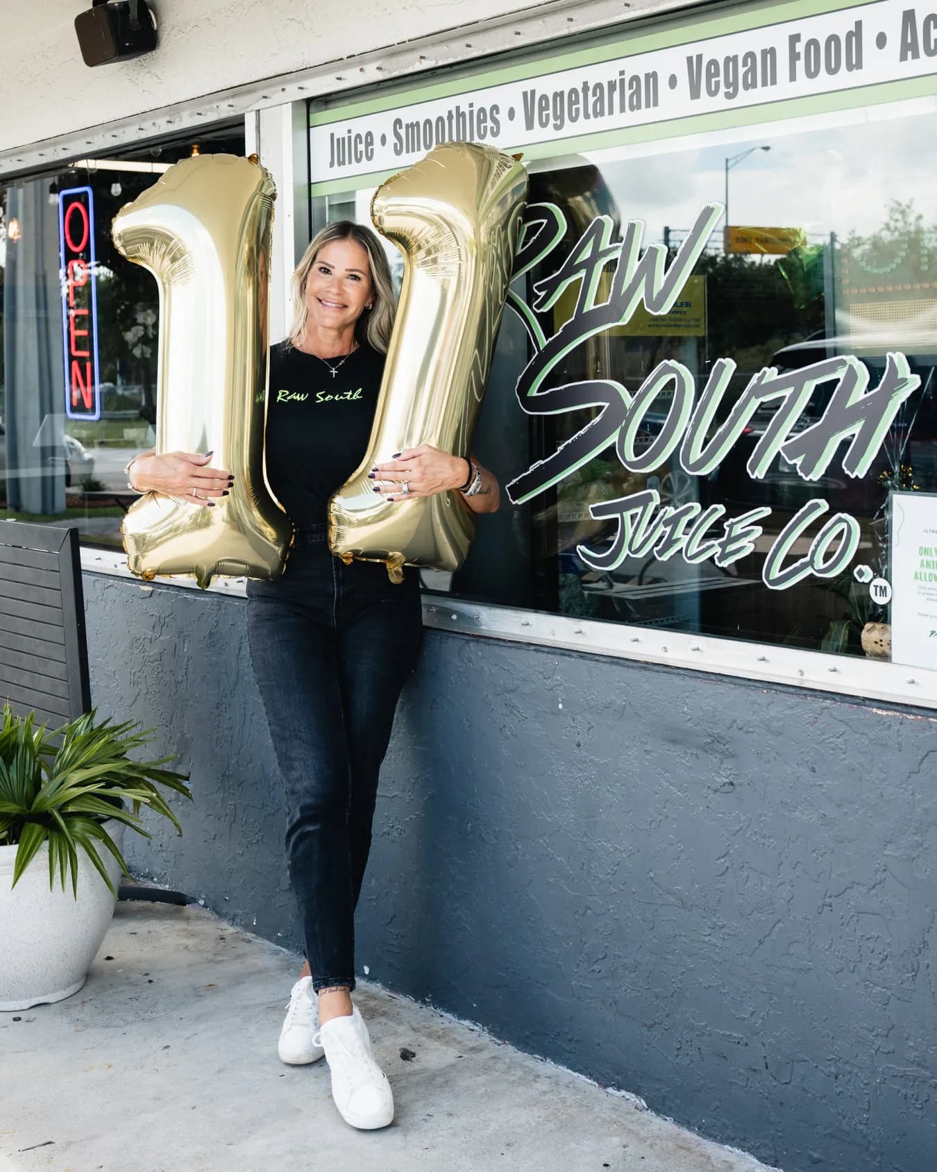 Yesenia Gomez standing outside Raw South Juice Co.