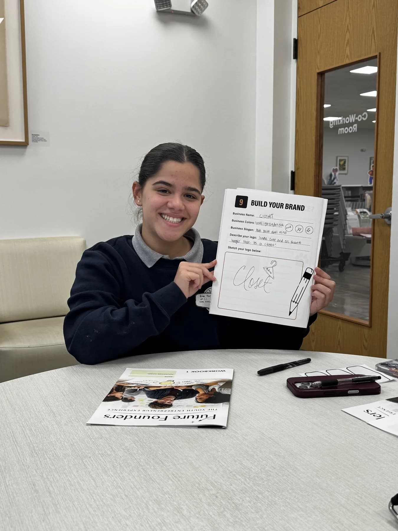 A student sharing completed work from a Future Founders session.